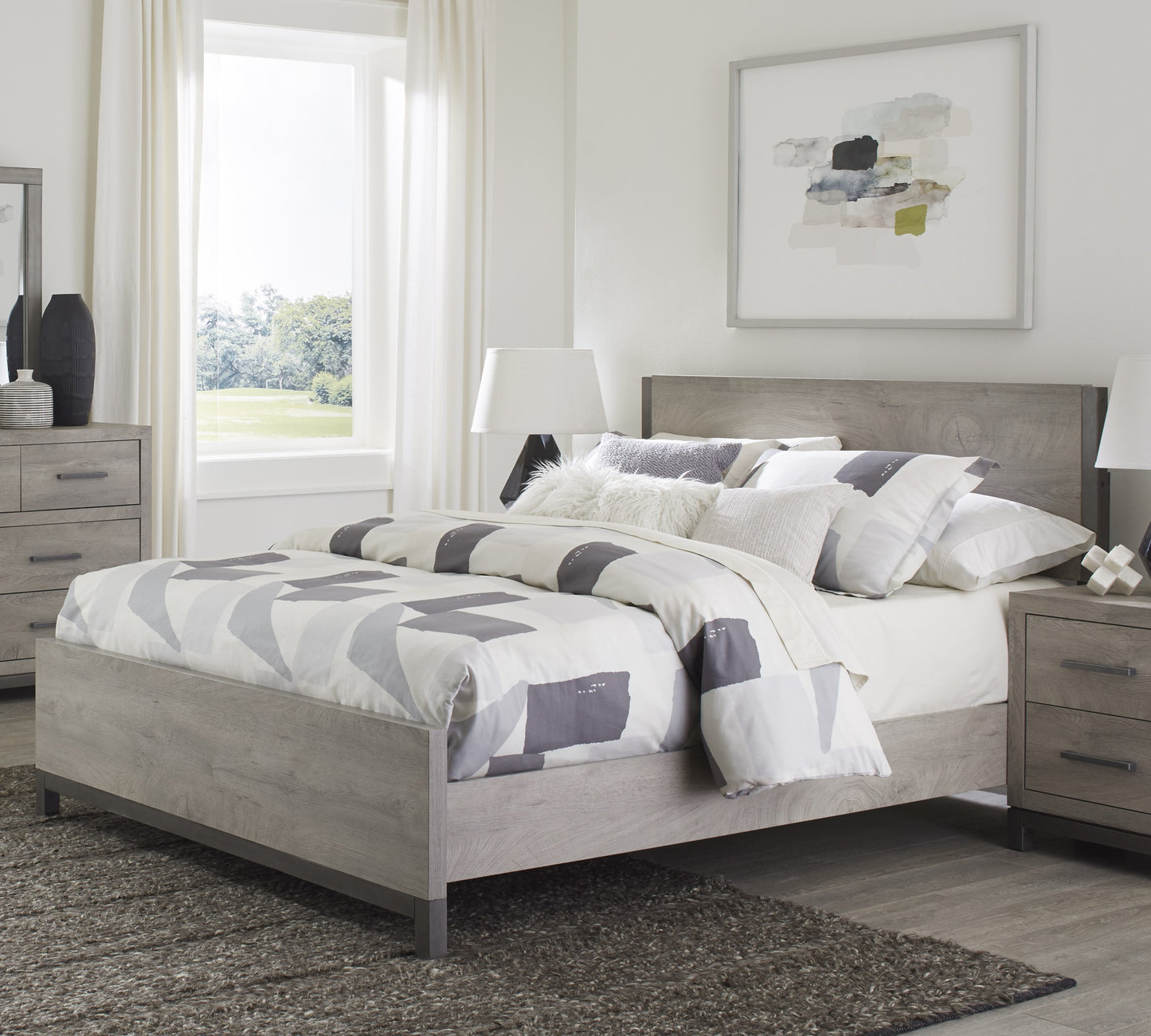 Grey wood platform bed frame with modern geometric bedding Perfect for a bedroom