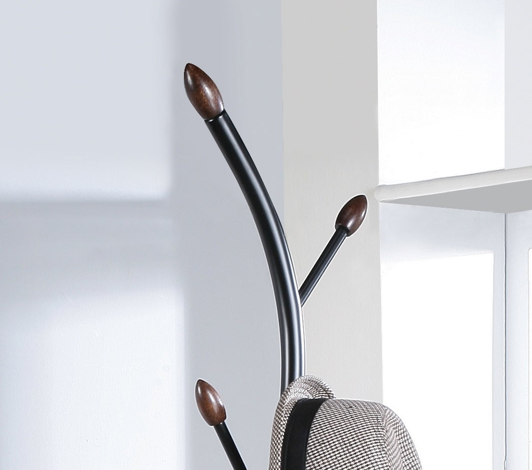 Modern black metal coat rack with wood accents and hanging hat
