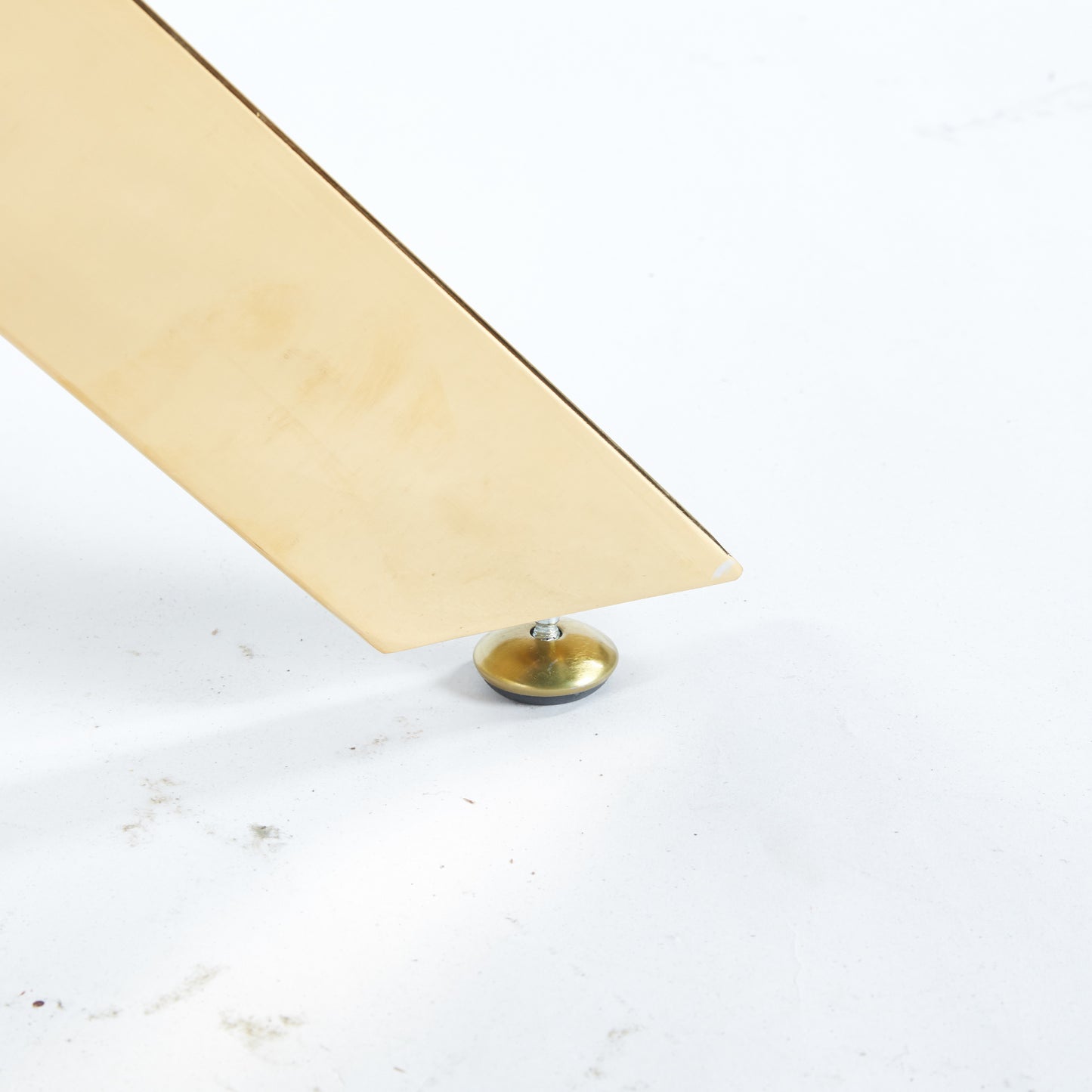 Polished brass table leg with adjustable leveling foot
