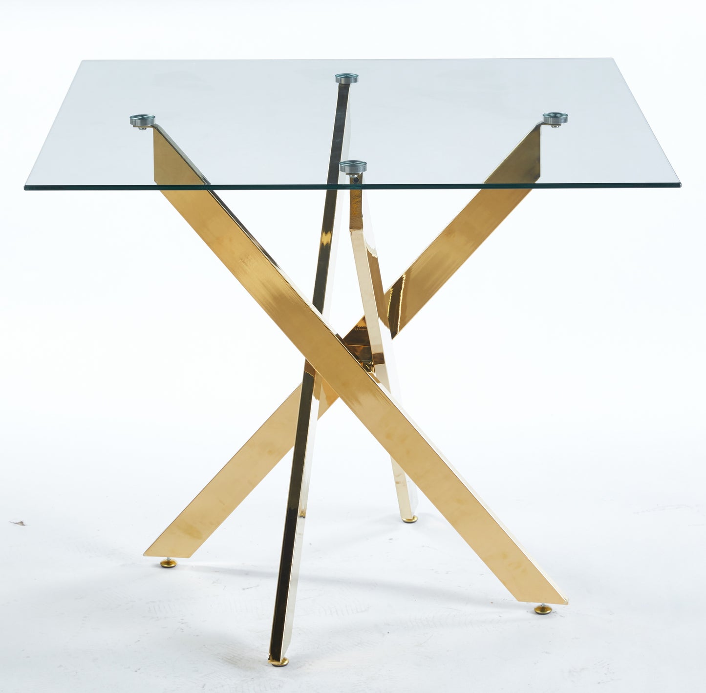 Modern glass dining table with a striking gold crossleg base