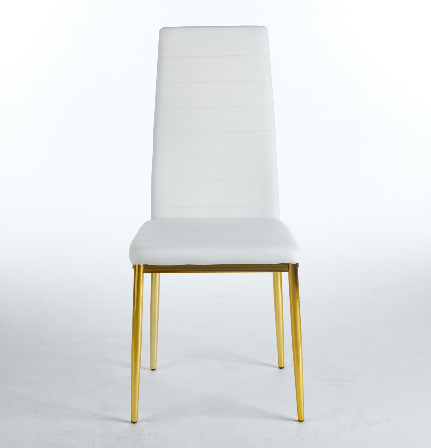 White faux leather dining chair with quilted back and gold metal legs