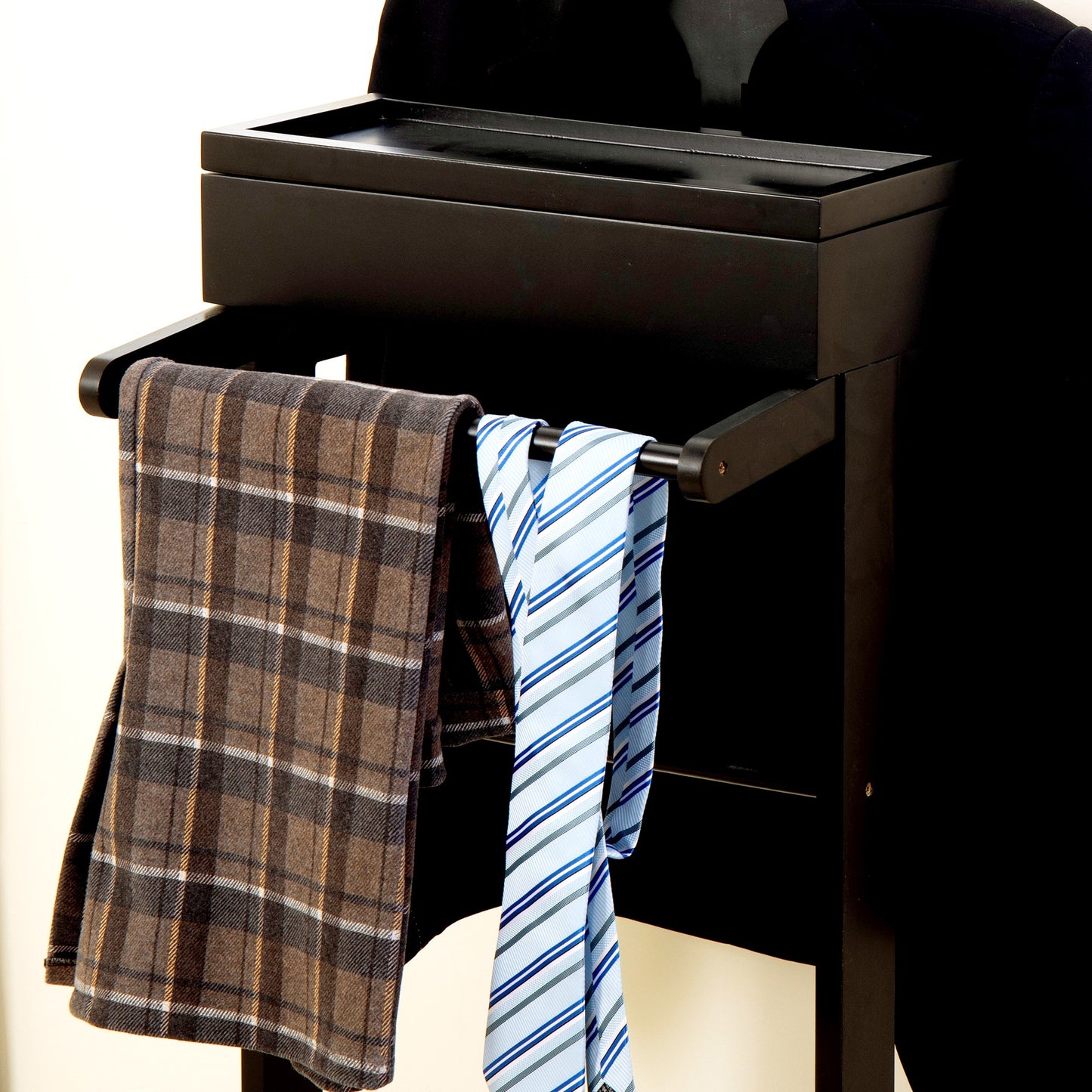 Black valet stand with plaid scarf and striped ties