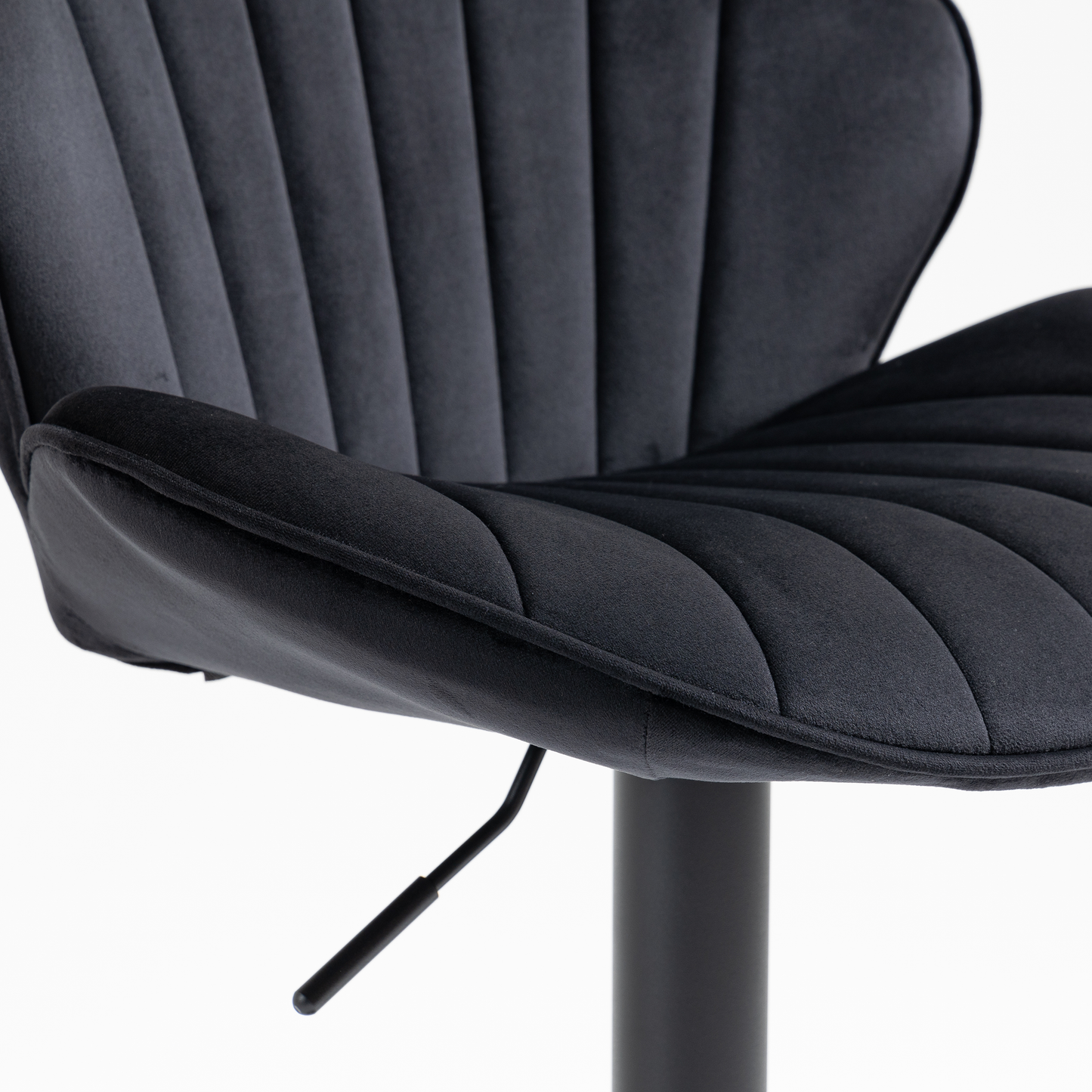 Black velvet bar stool with channel tufting and adjustable height lever
