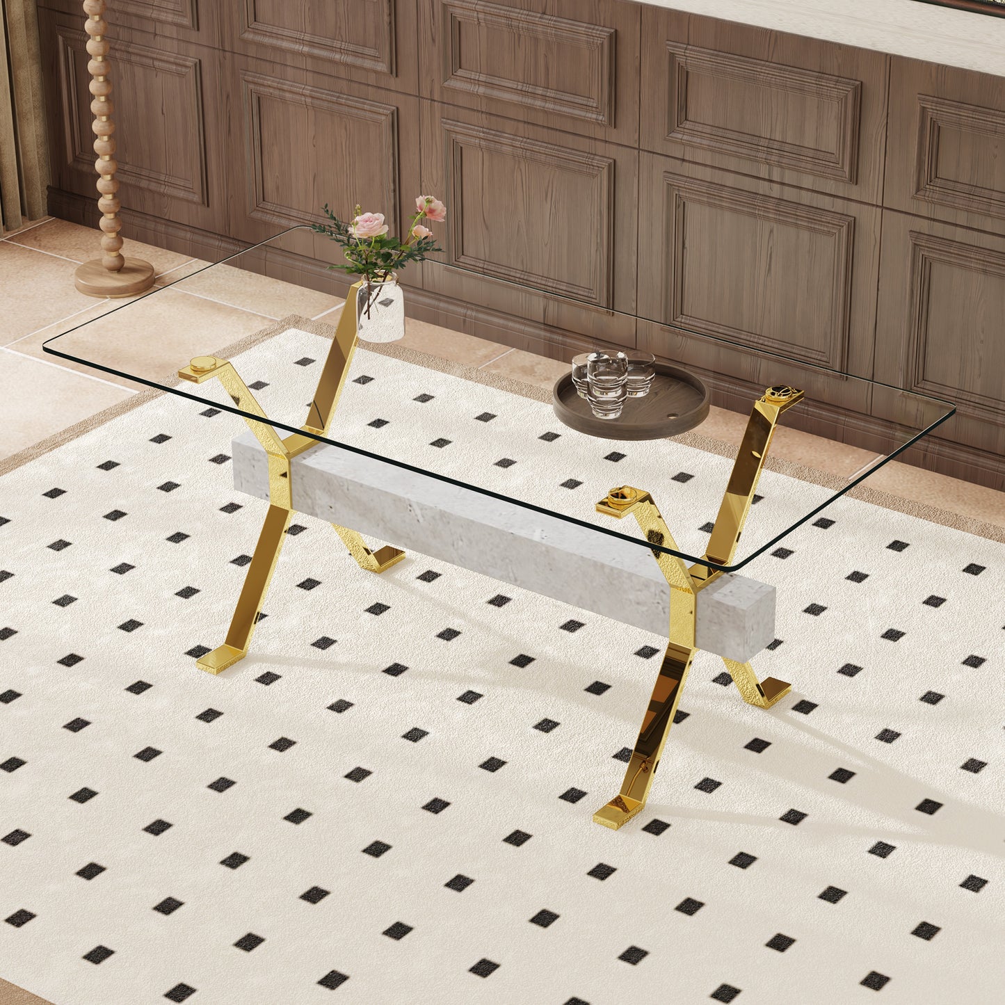 Modern glass coffee table with polished gold legs and marble base