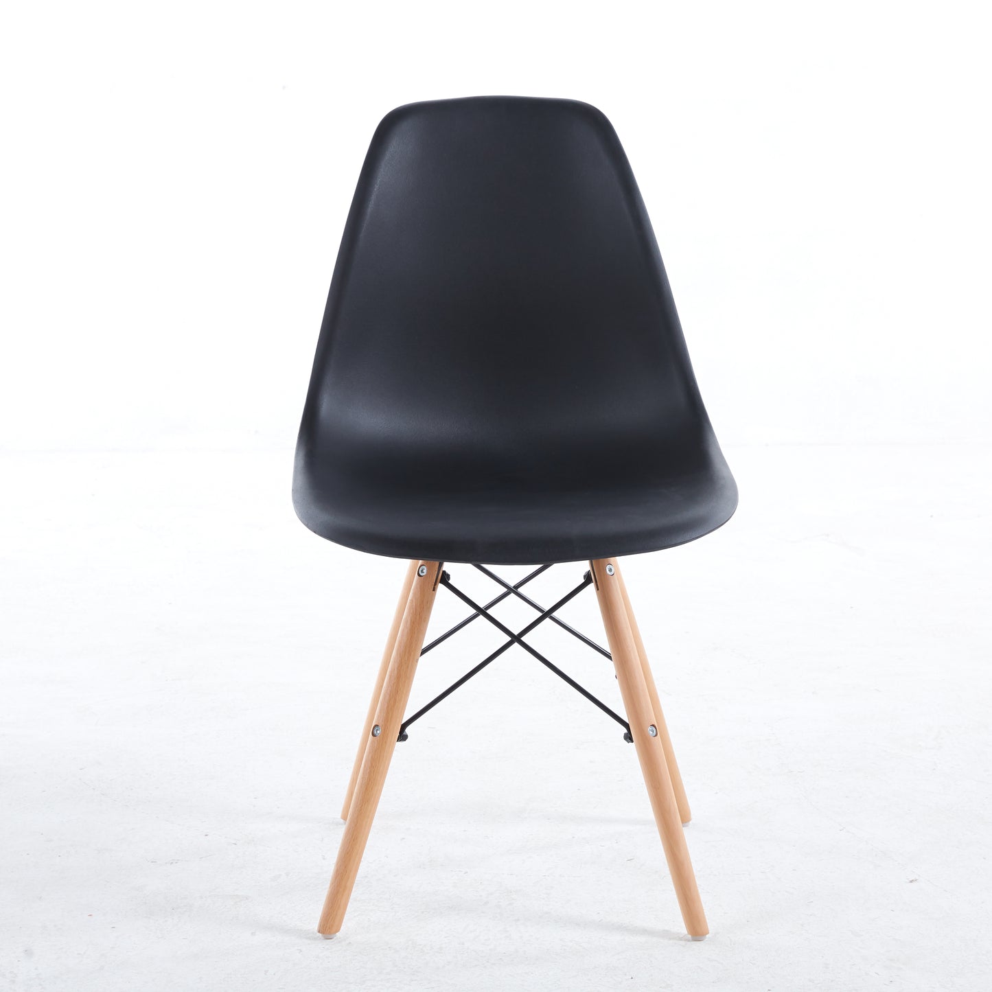 Black molded dining chair with natural wood legs
