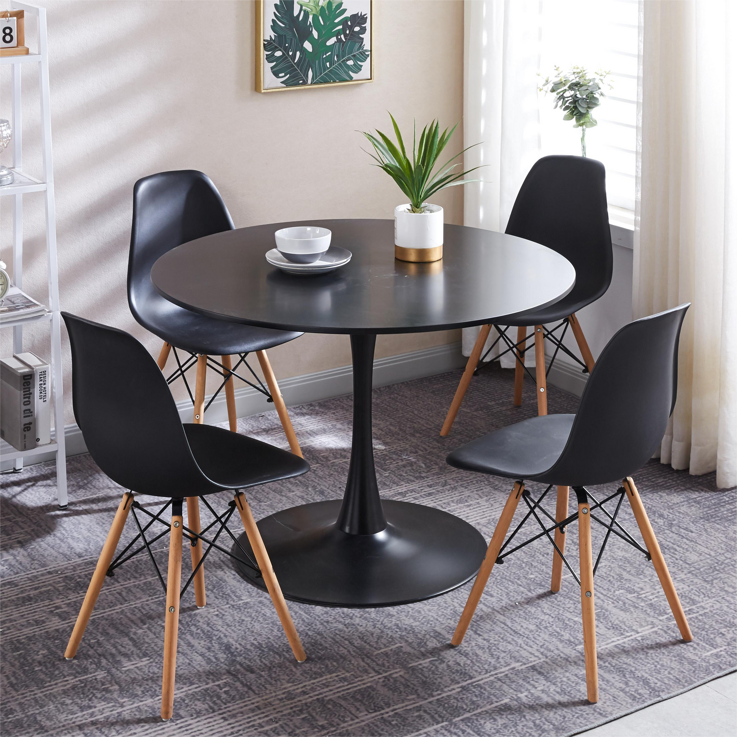 Black tulip dining table with four chairs