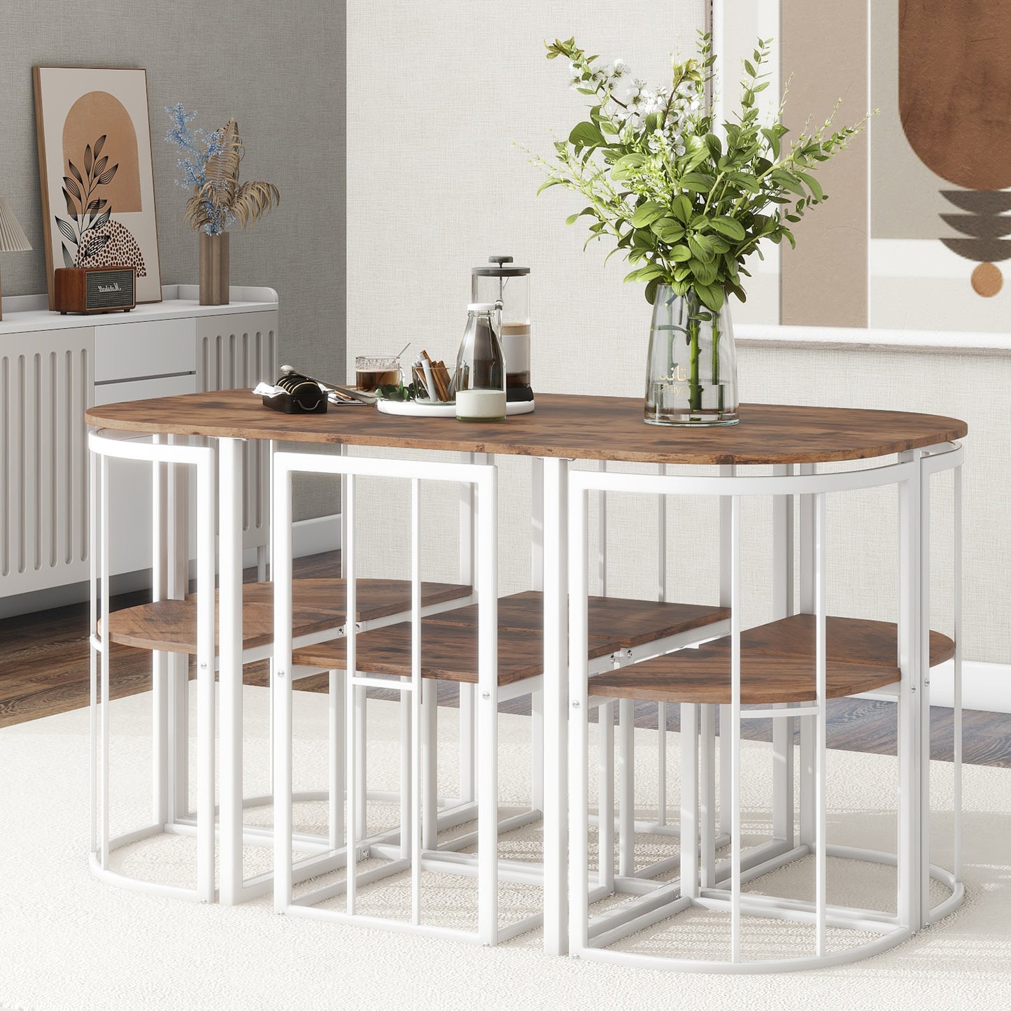 Oval dining table with rustic wood top and white metal frame with four chairs