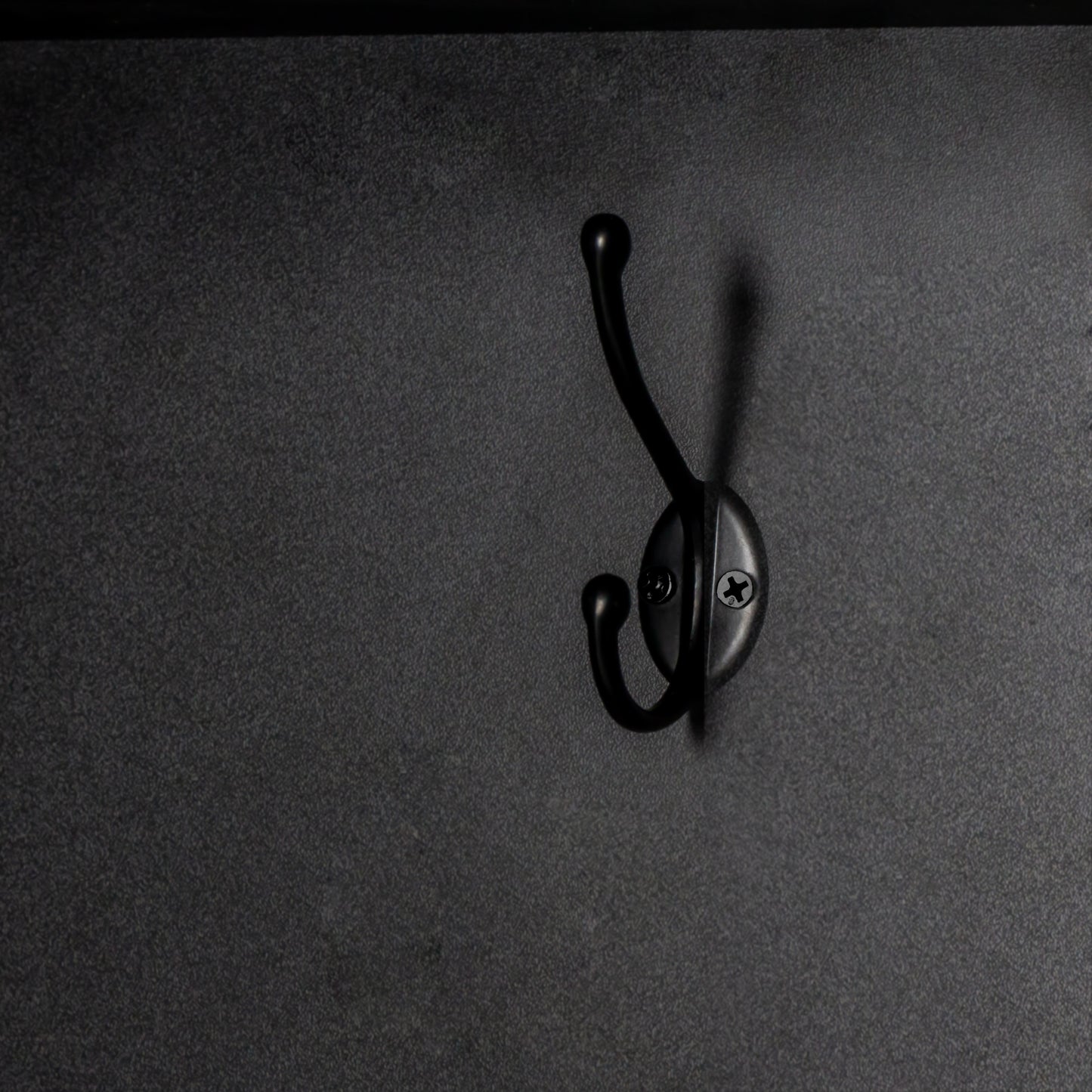 Black metal double hook for hanging coats