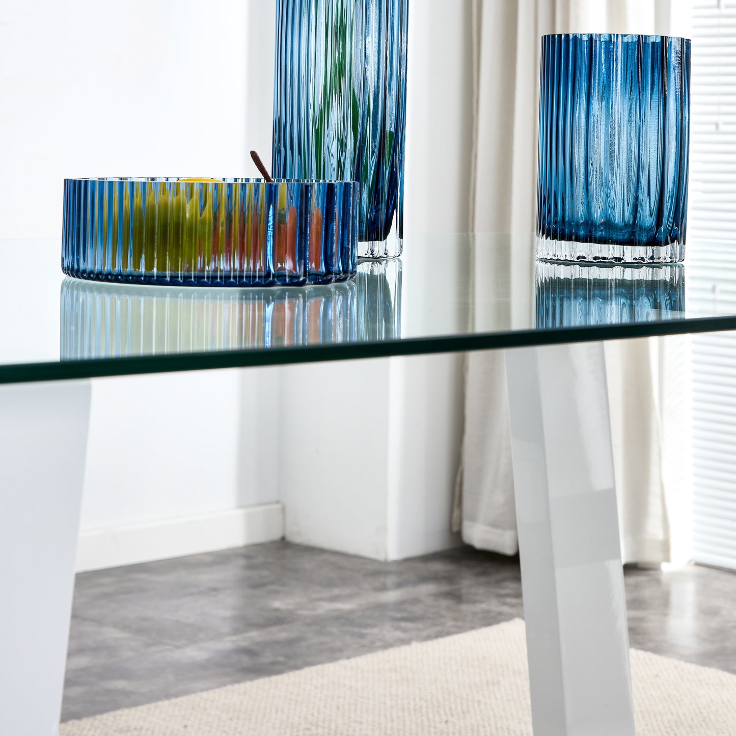 Blue fluted glass fruit bowl with pears and lemons