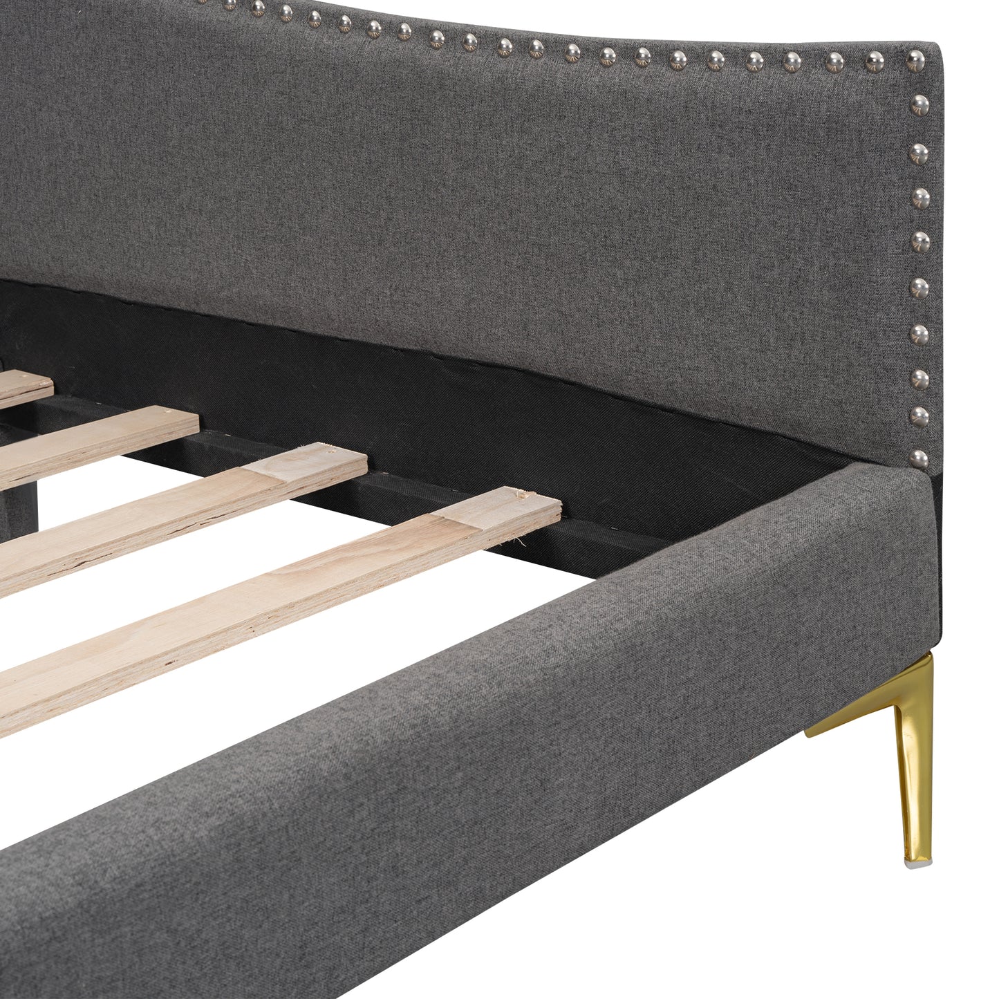 Dark gray upholstered bed frame with silver nailhead trim and gold legs