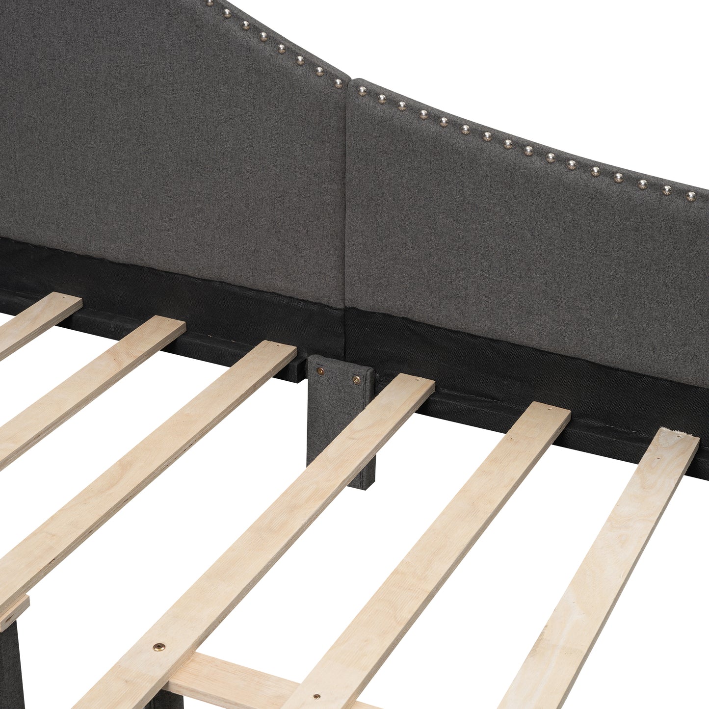 Dark grey fabric headboard with silver nailhead trim and wooden slats