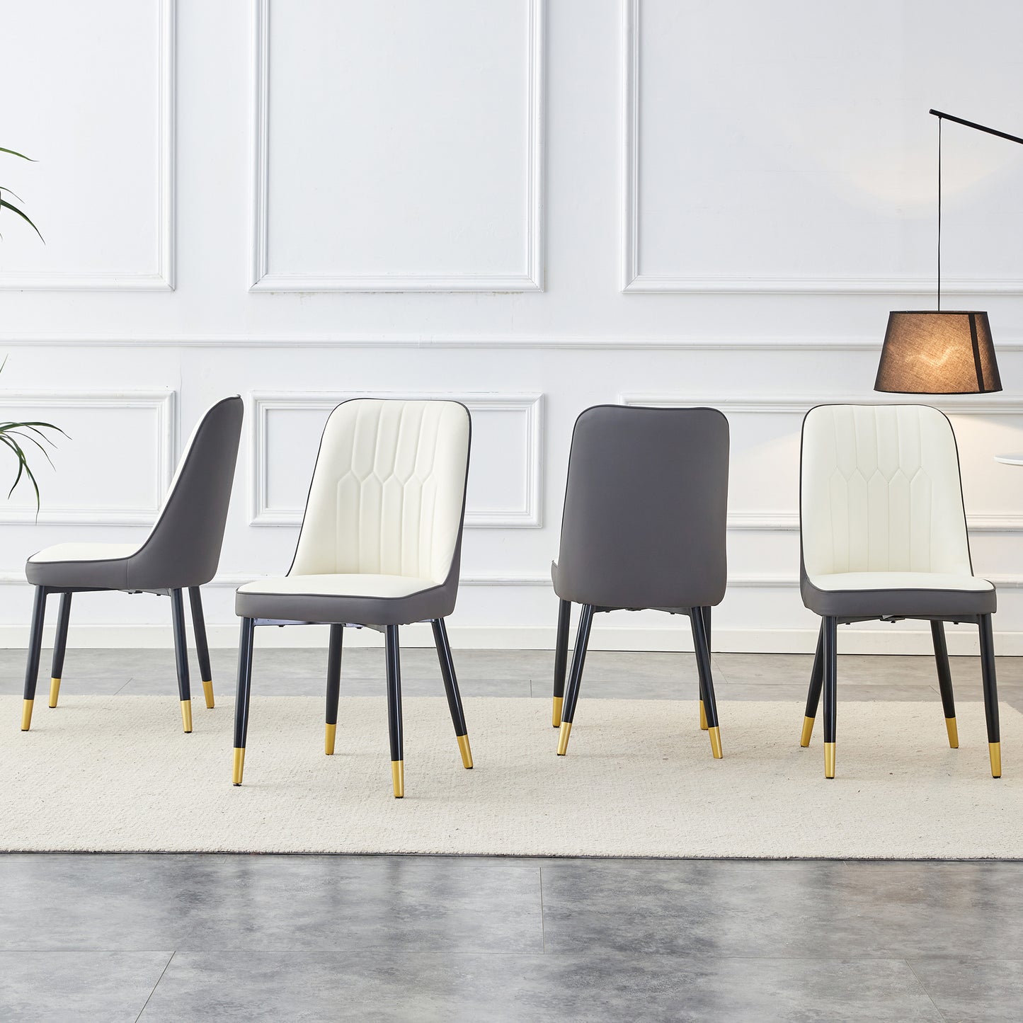 Cream and dark gray upholstered dining chair with goldtipped legs