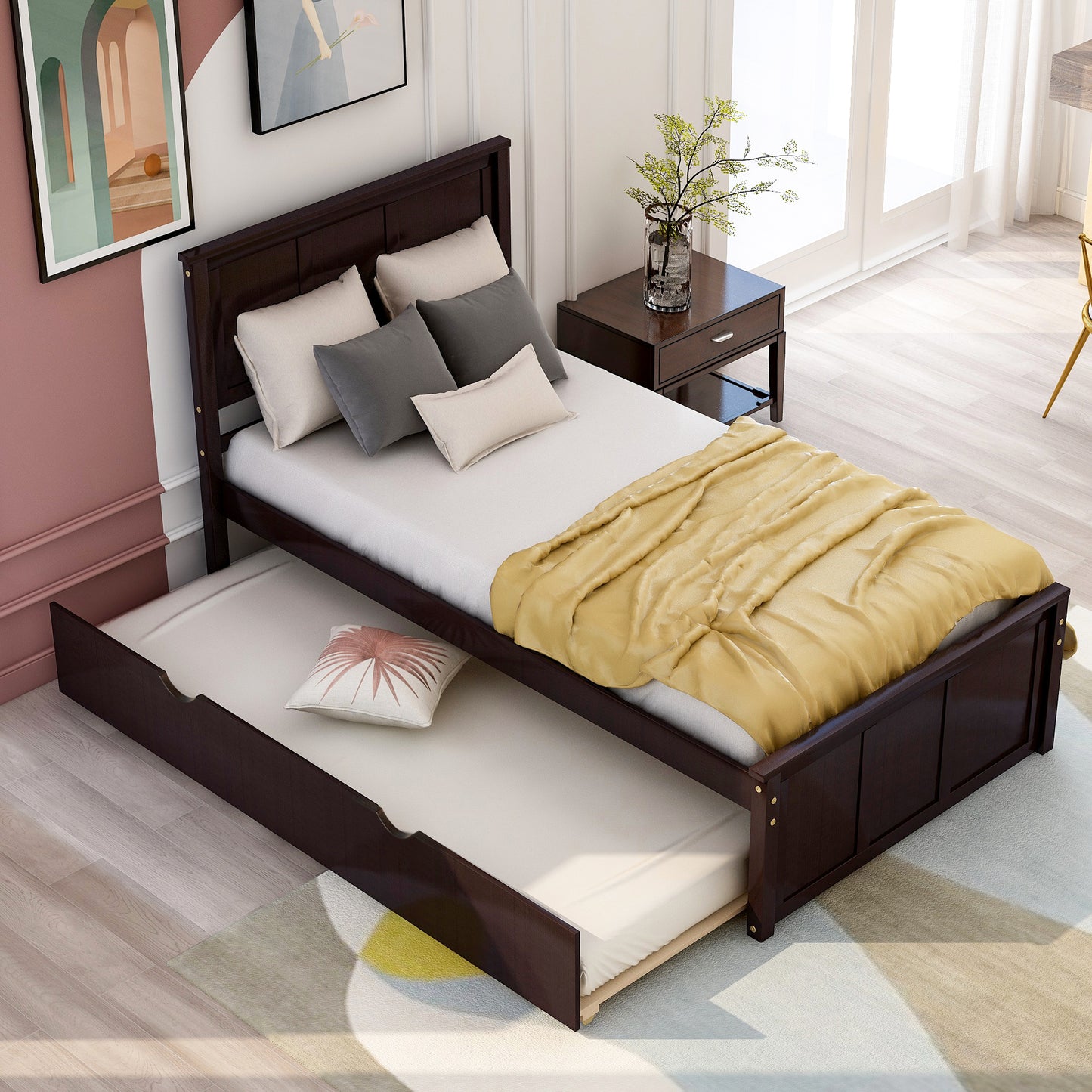 Dark wood trundle bed with yellow blanket and pillows