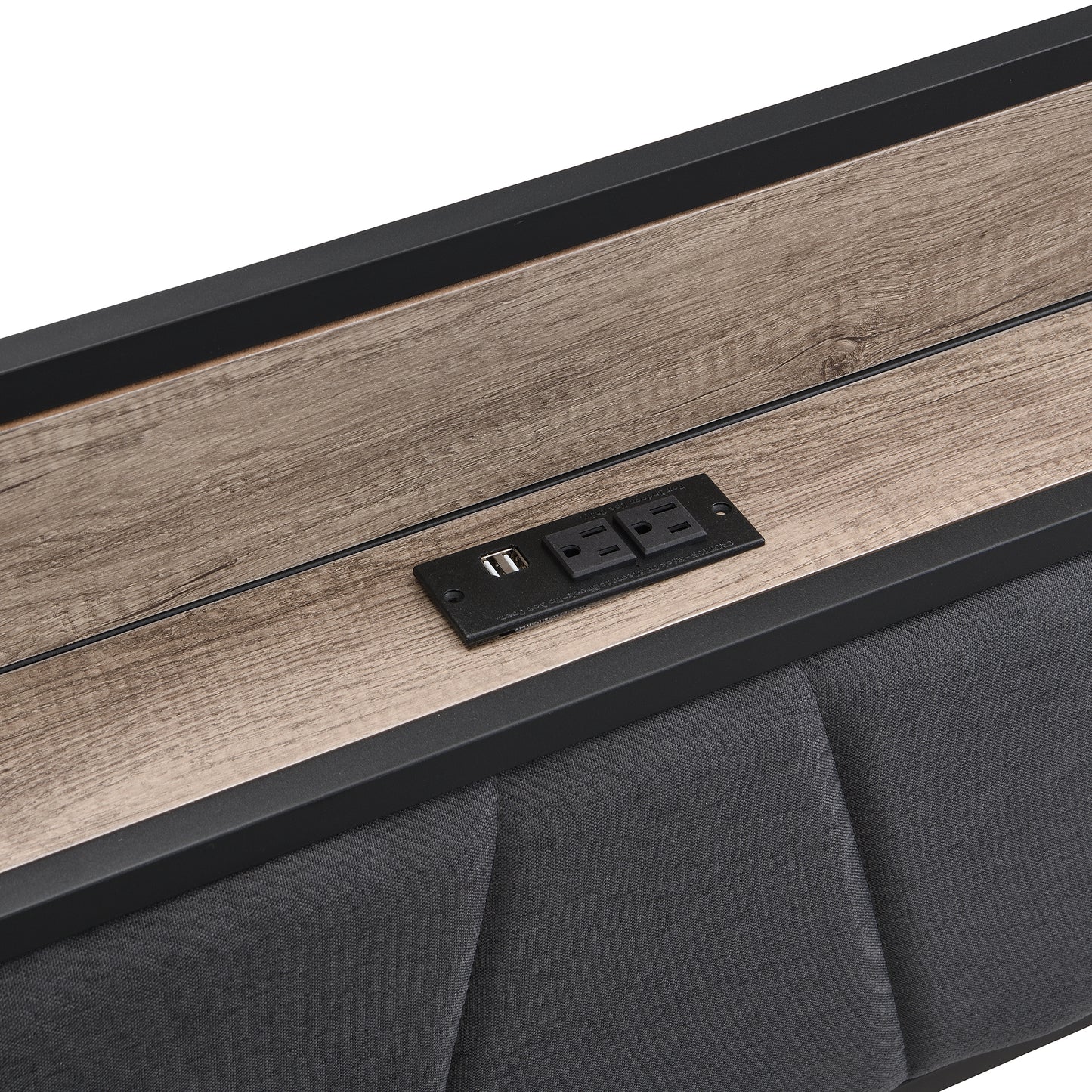Black upholstered headboard detail with integrated woodgrain charging station and USB port
