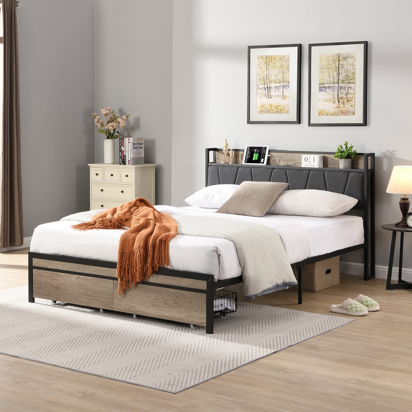 Grey upholstered bed frame with builtin headboard shelf and wood drawer accents