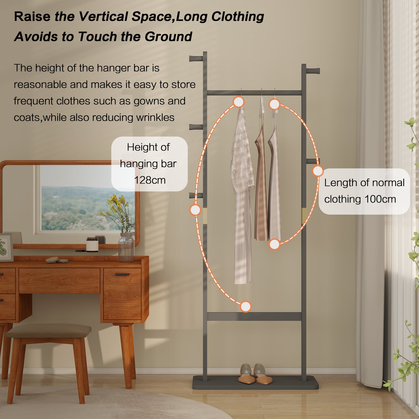 Modern dark gray metal garment rack with four hangers displaying flowy dresses