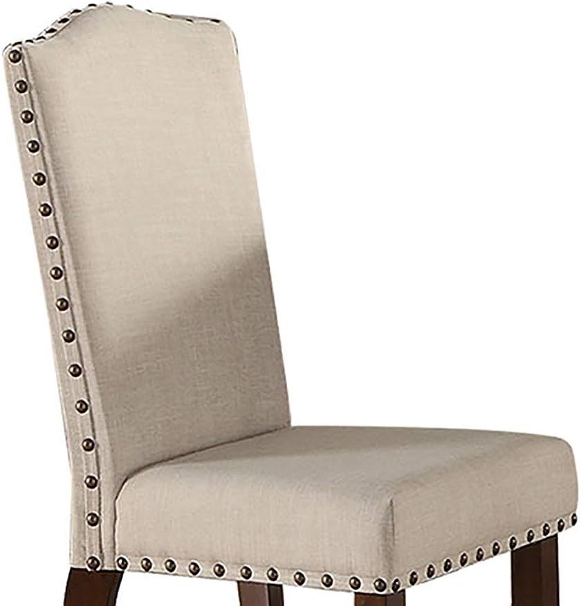 Beige upholstered dining chair with nailhead trim