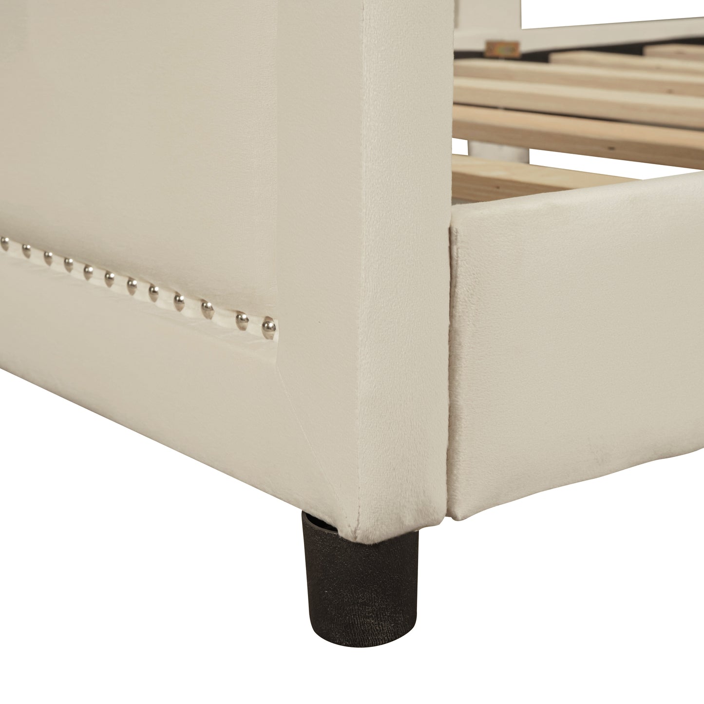 Cream upholstered bed frame with silver nailhead trim