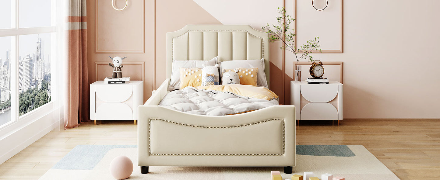 Cream upholstered twin bed with button tufting and silver nailhead trim