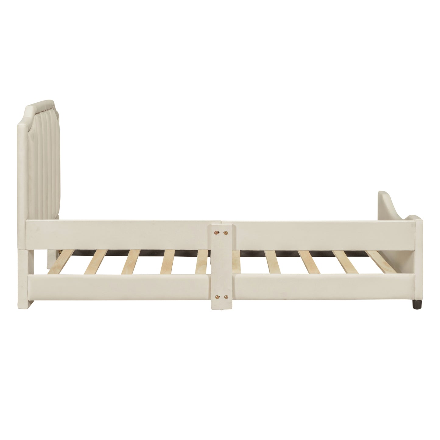 Tufted cream upholstered toddler bed with wooden slats and a low profile for easy access