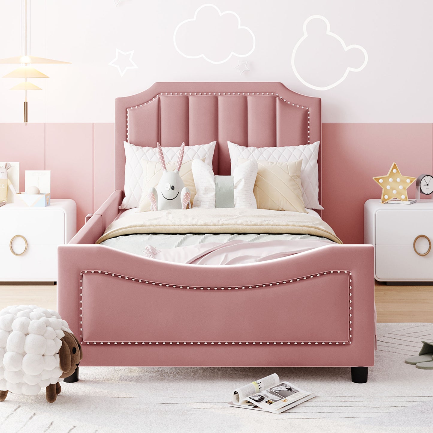 Pink velvet twin bed with tufted headboard and nailhead trim