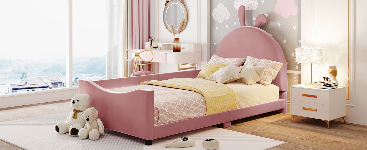 Pink velvet toddler bed with bunny ears headboard and protective rails