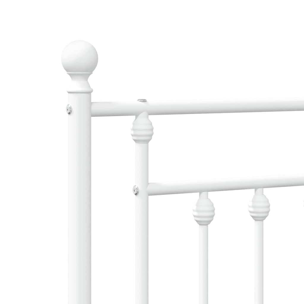 White metal twin bed frame with decorative finials on headboard