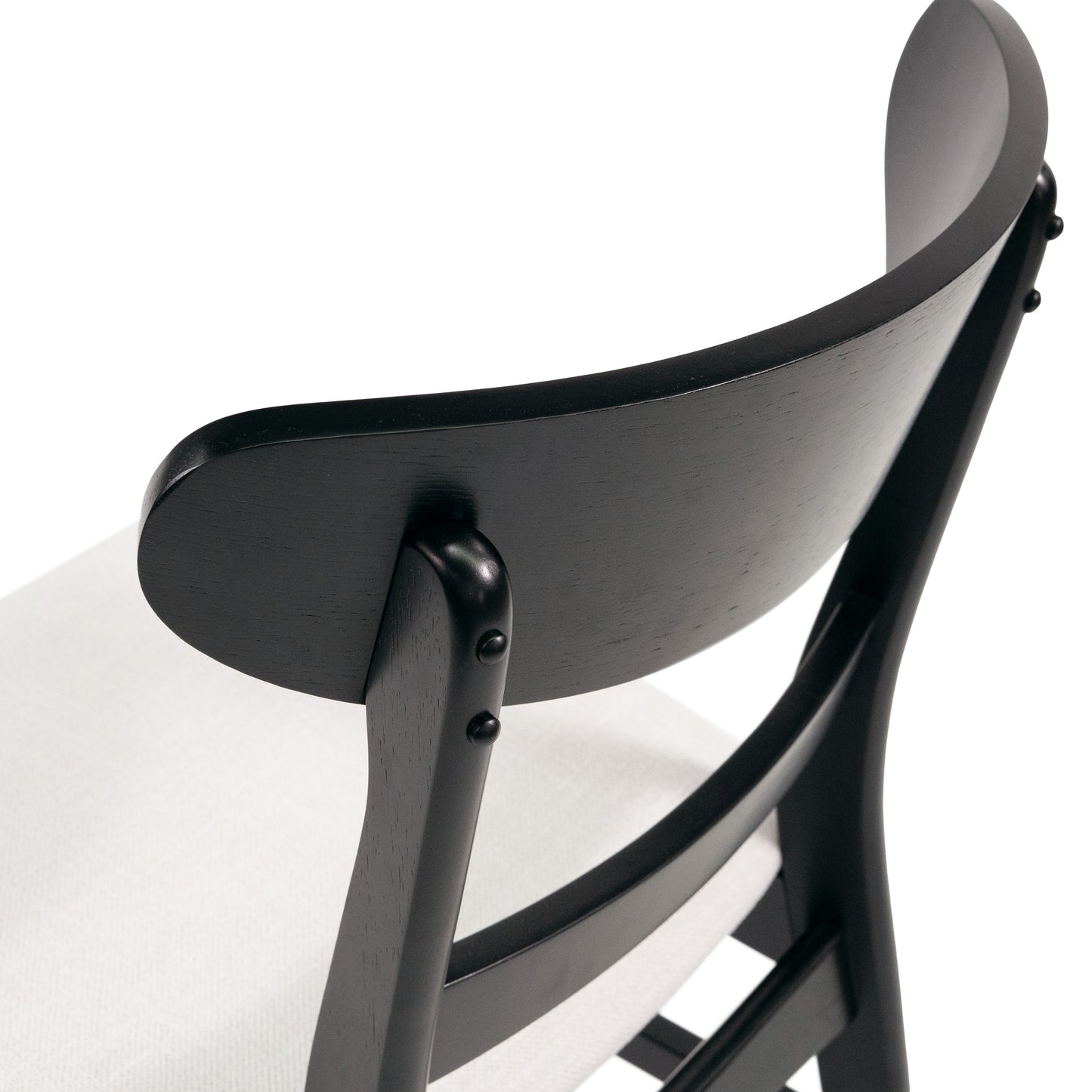 Dark wood chair with curved backrest and textured white seat