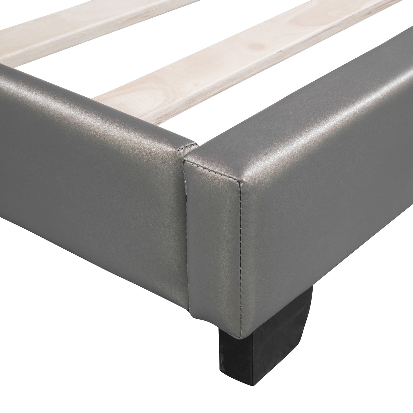 Grey faux leather bed frame corner with wooden slats and black leg