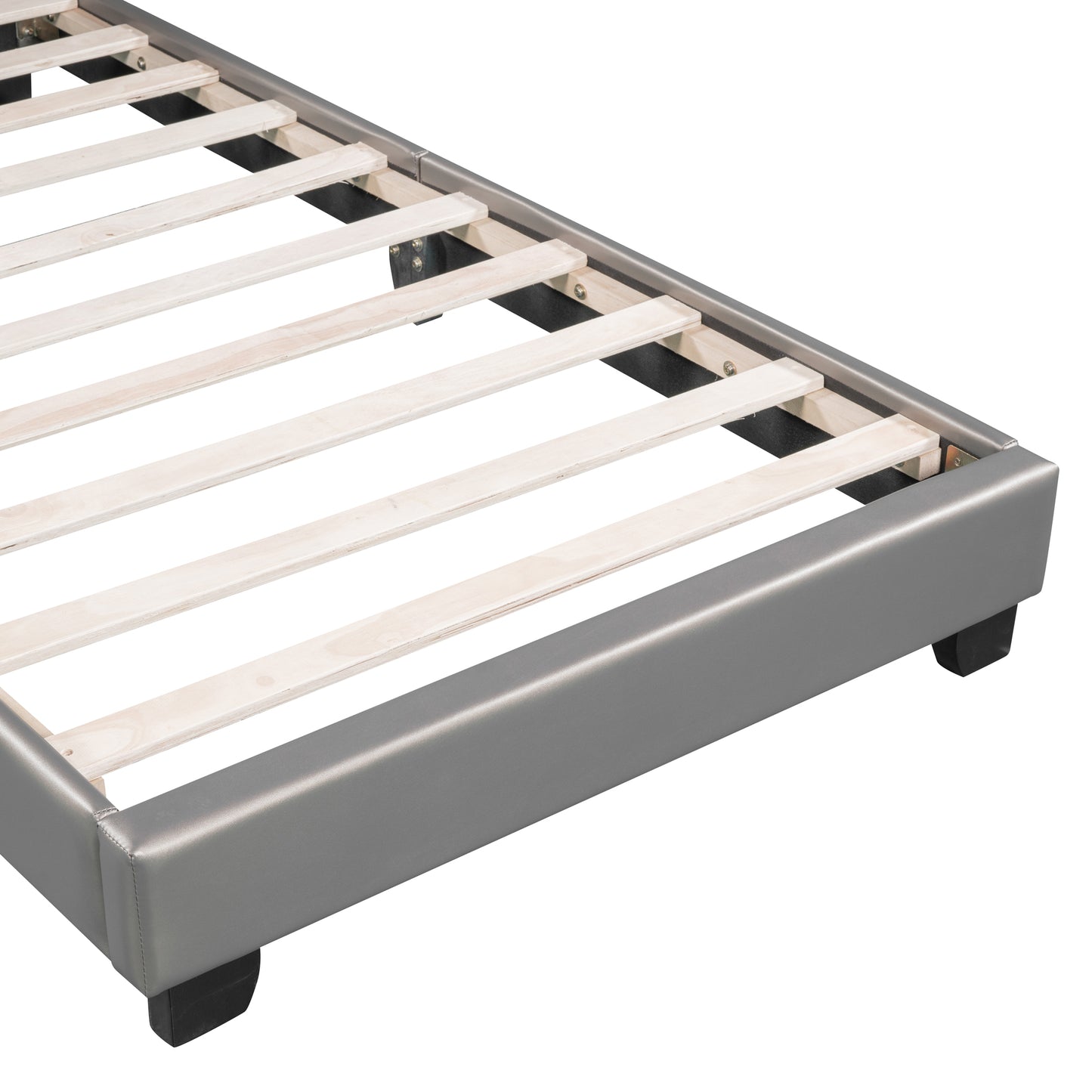 Closeup of grey upholstered bed frame with wooden slats