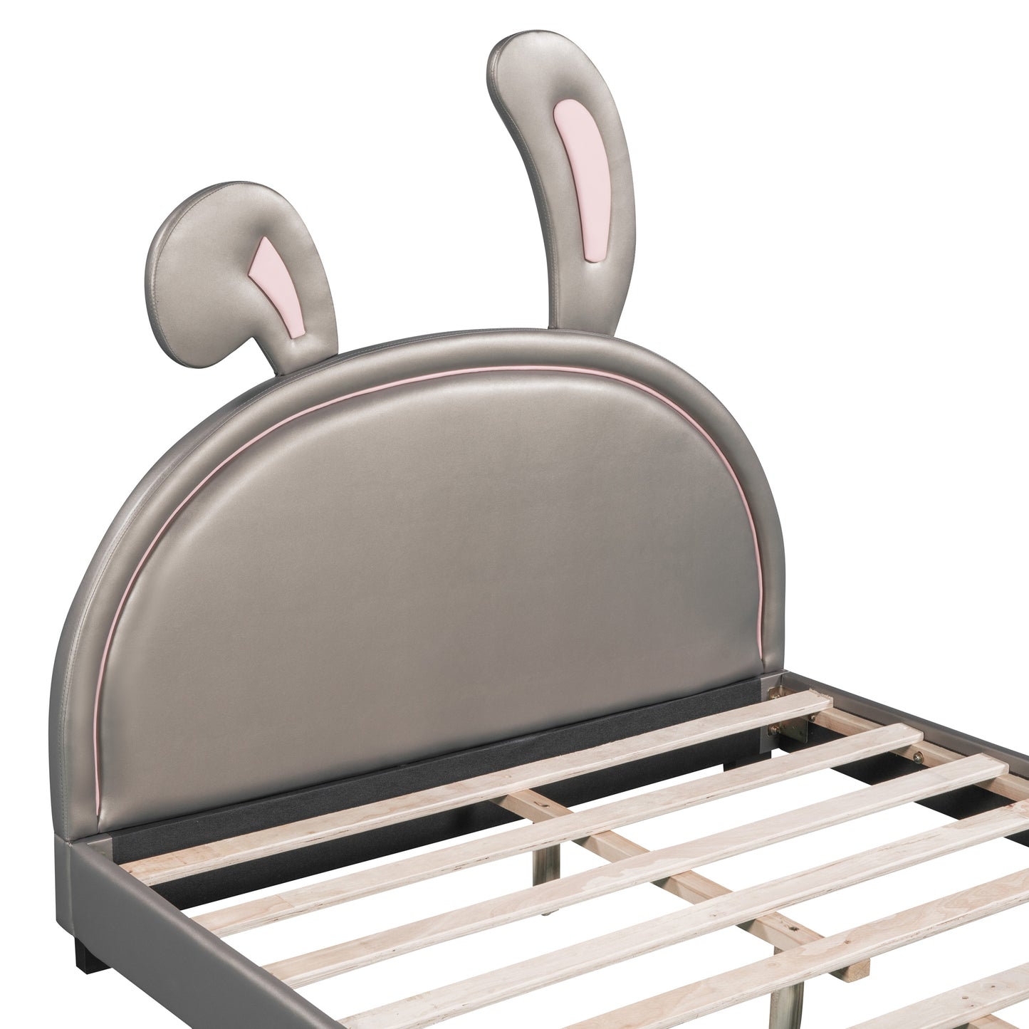 Gray faux leather toddler bed with pink bunny ear headboard