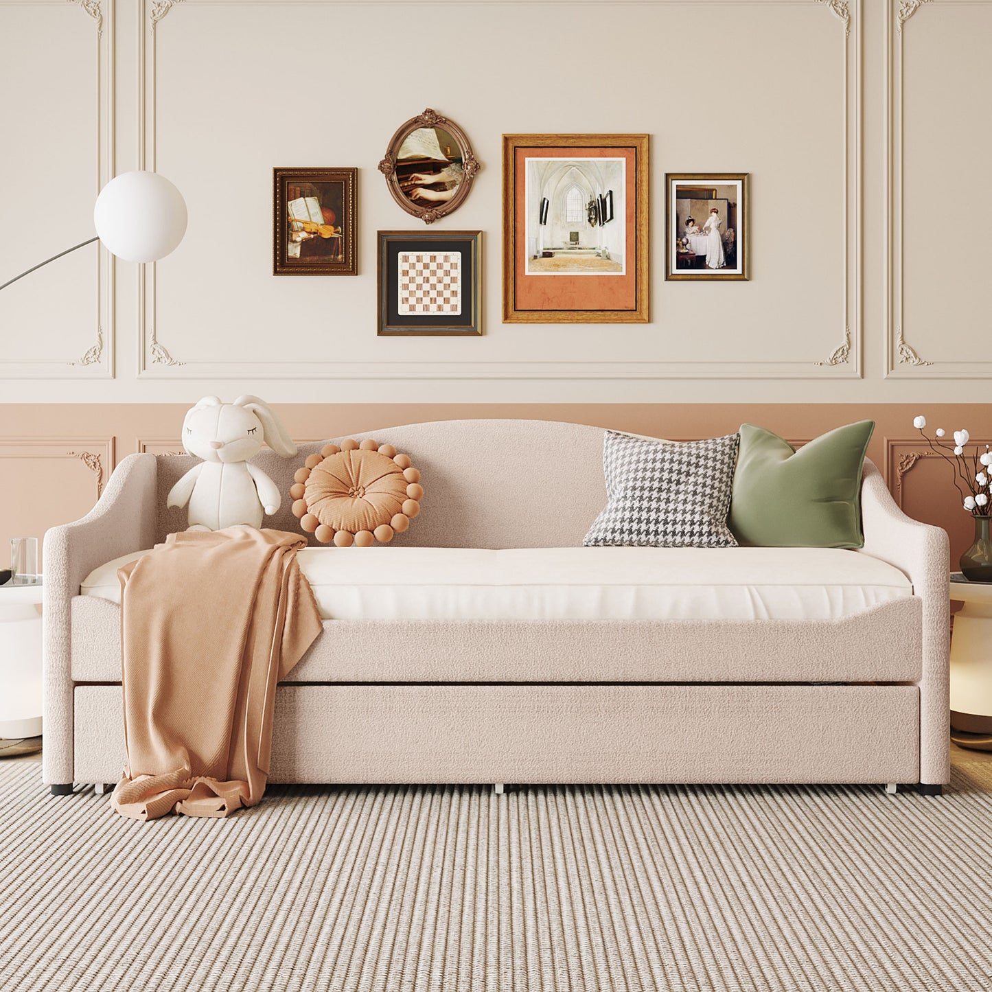 Plush upholstered daybed in light pink with a textured finish and throw blanket