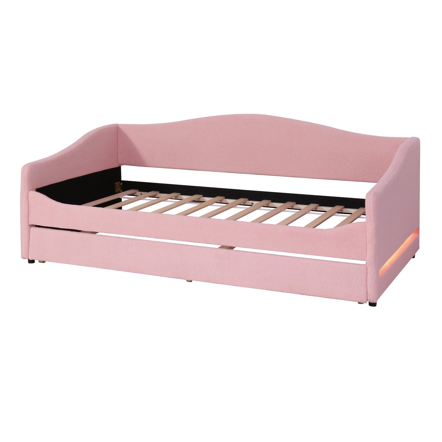 Pink upholstered daybed with rollout trundle and LED lighting