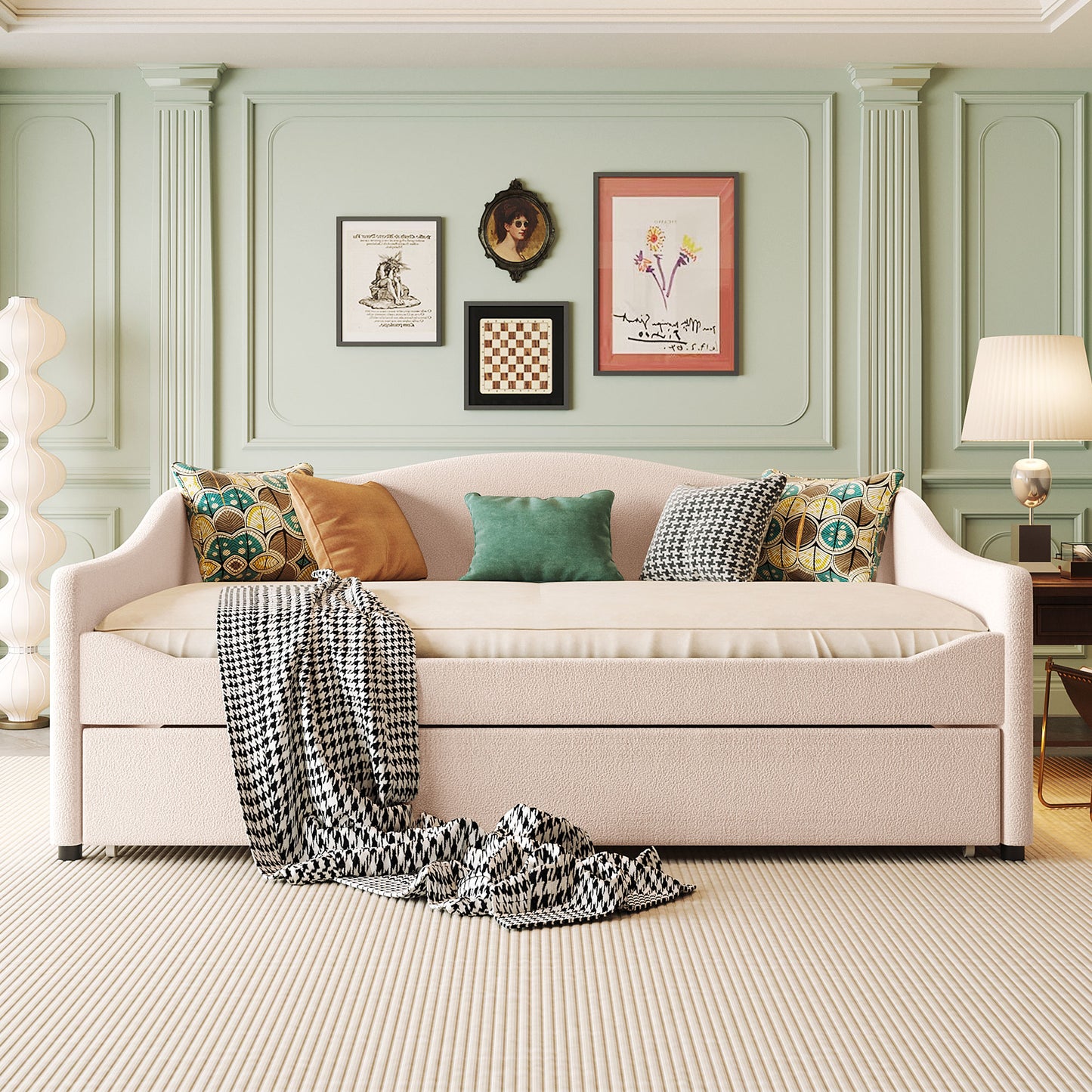 Pink boucle fabric daybed with houndstooth throw and decorative pillows