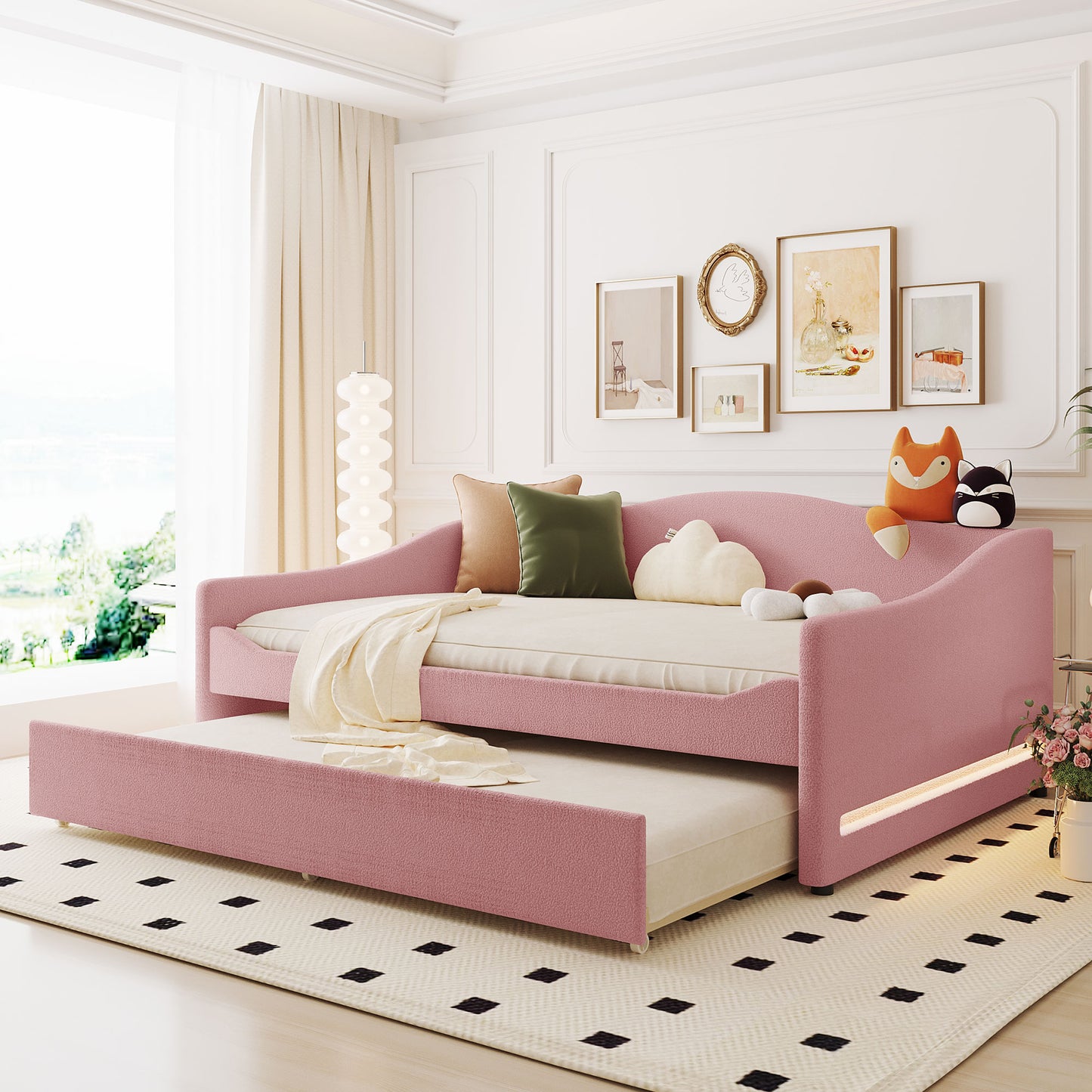 Pink upholstered daybed with pullout trundle