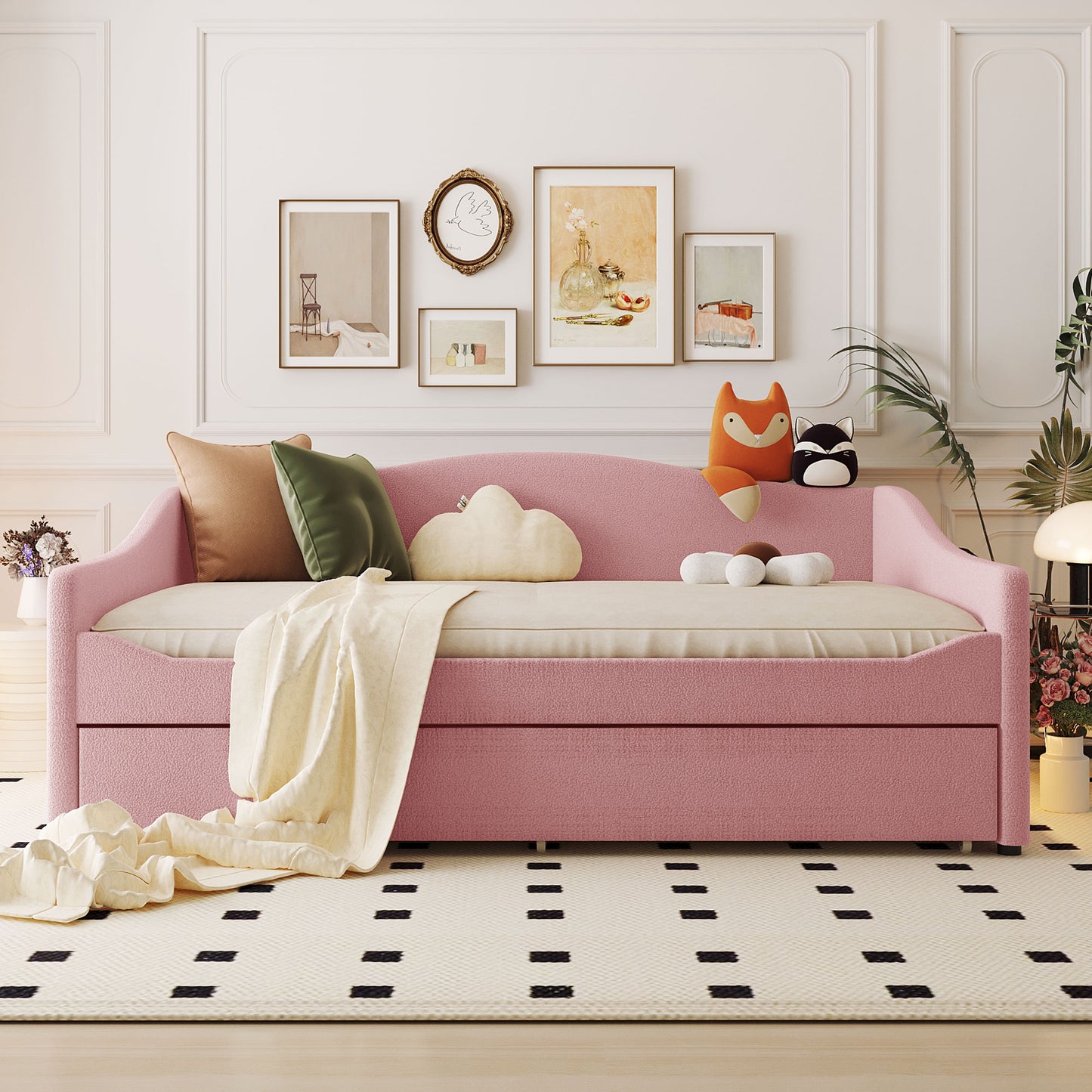 Pink boucle daybed with plush throw pillows and decorative animal pillows