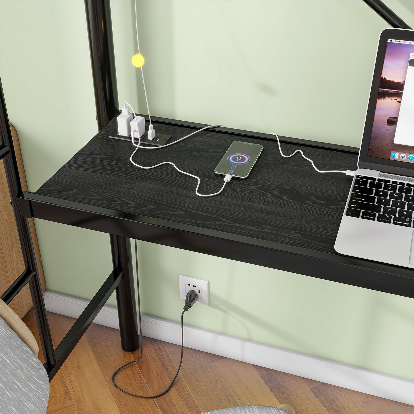 Black wood grain desktop with integrated power strip charging phone laptop
