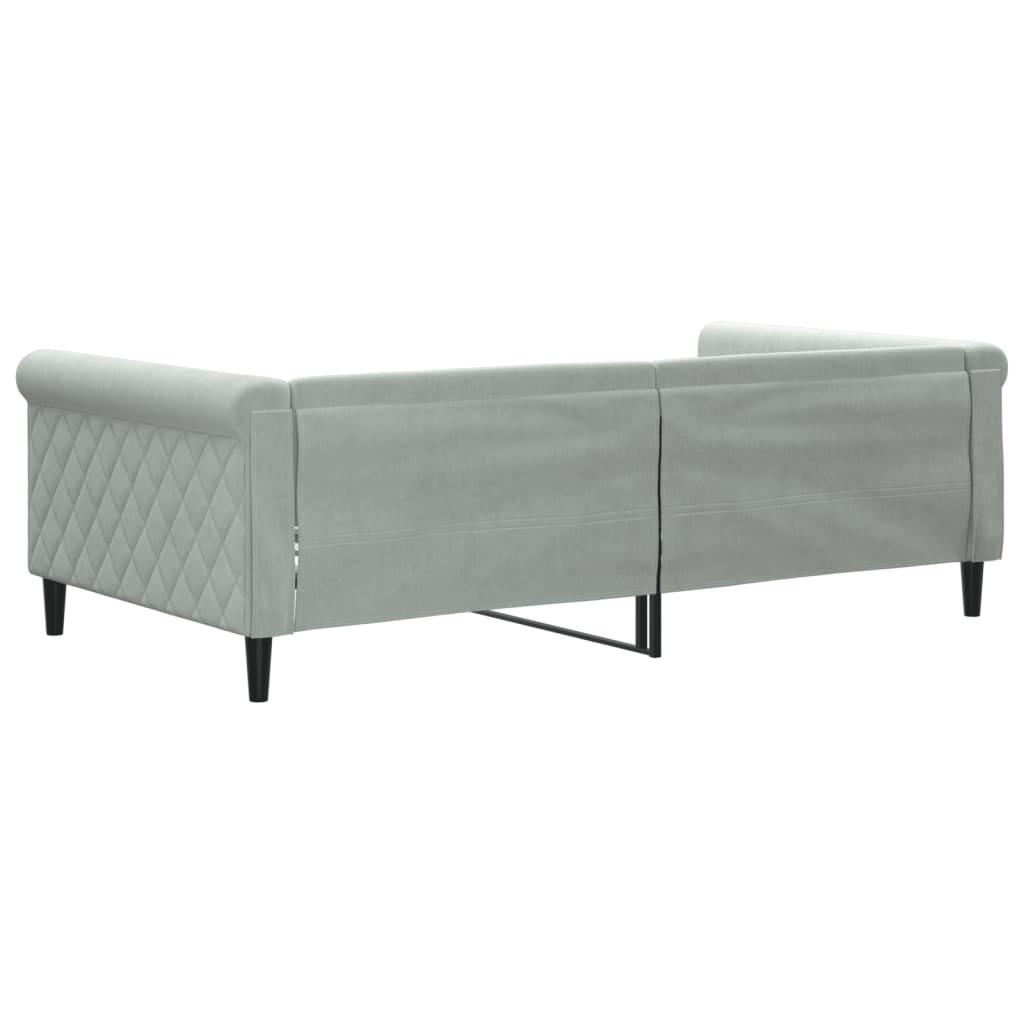Light gray upholstered sofa with diamond tufting