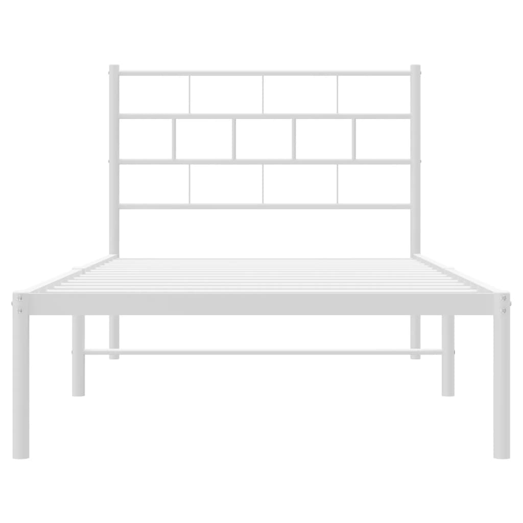 Modern white metal bed frame with a slatted headboard and bedding