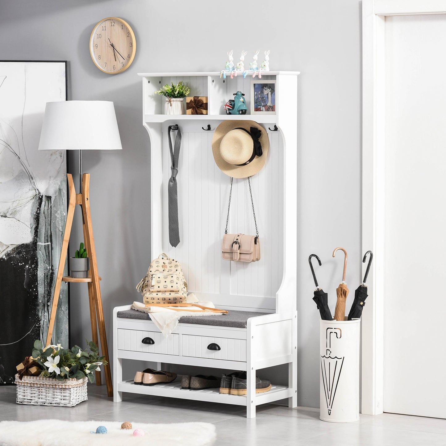 White wooden hall tree with storage bench and hat hooks