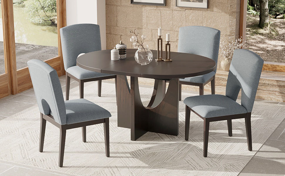 Dark wood oval dining table with four upholstered blue chairs