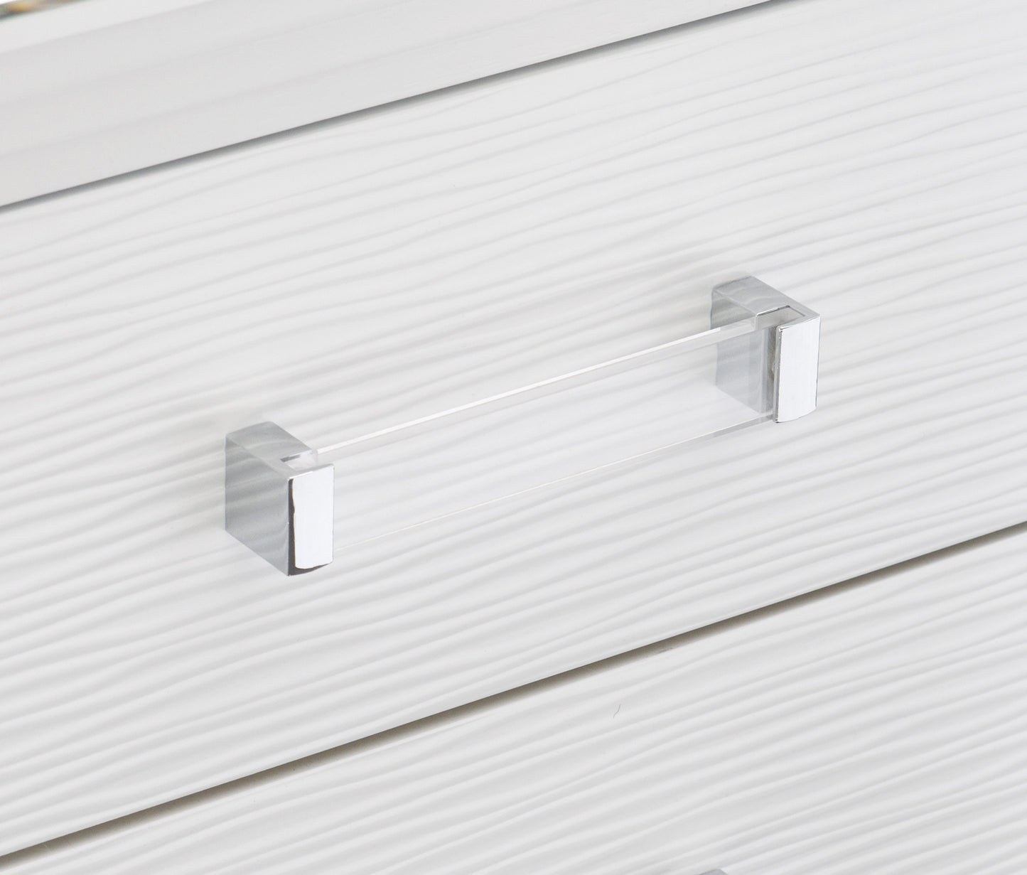 White wavetextured drawer front with a modern clear acrylic and chrome handle