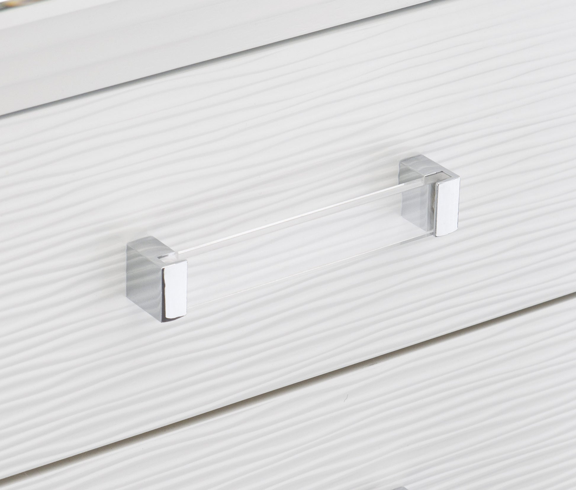 White wavetextured drawer front with a modern clear acrylic and chrome handle