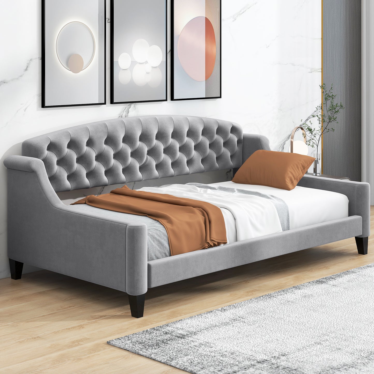 Grey velvet daybed with tufted back ideal for a modern bedroom