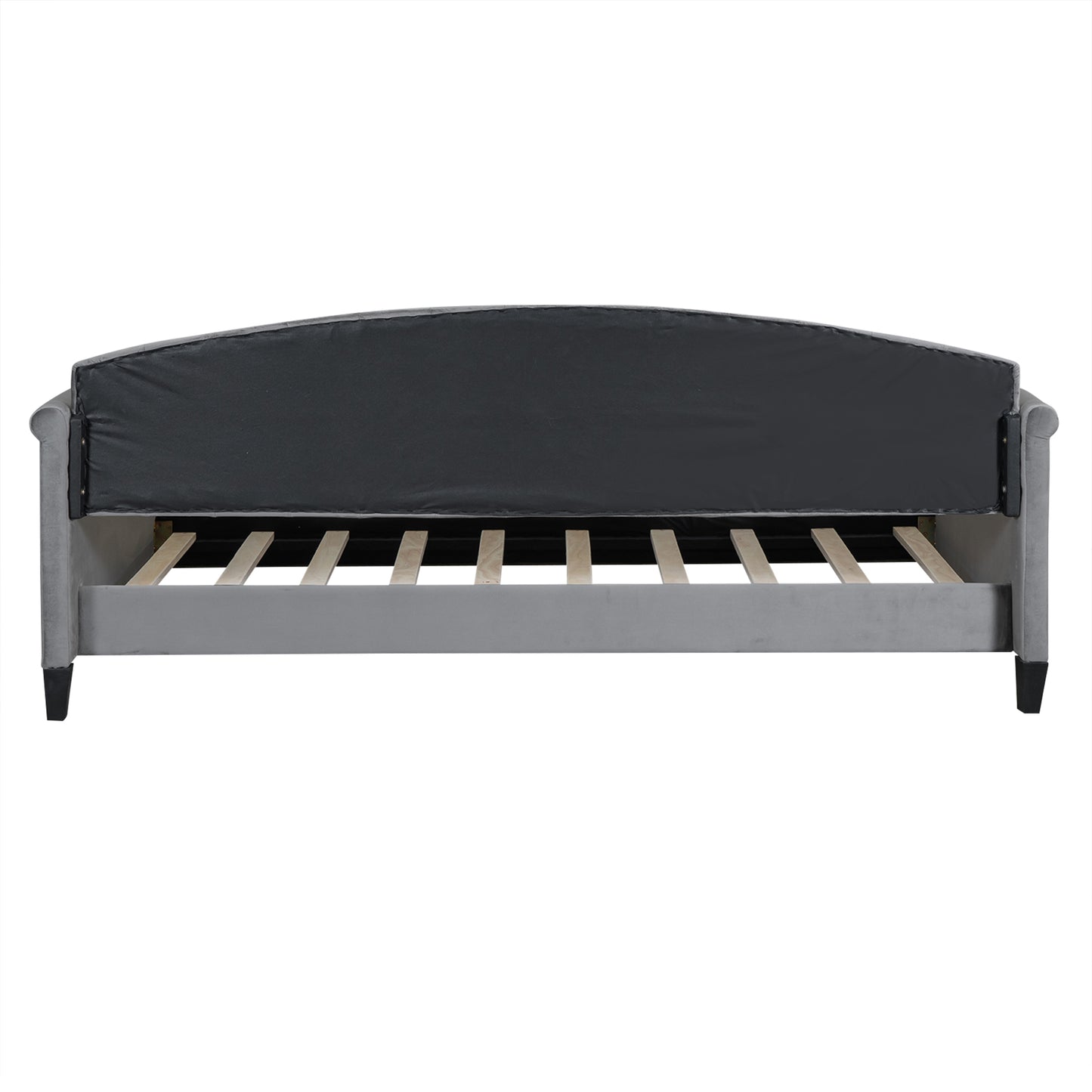 Grey velvet upholstered bed frame showing curved headboard support and wooden slats for mattress