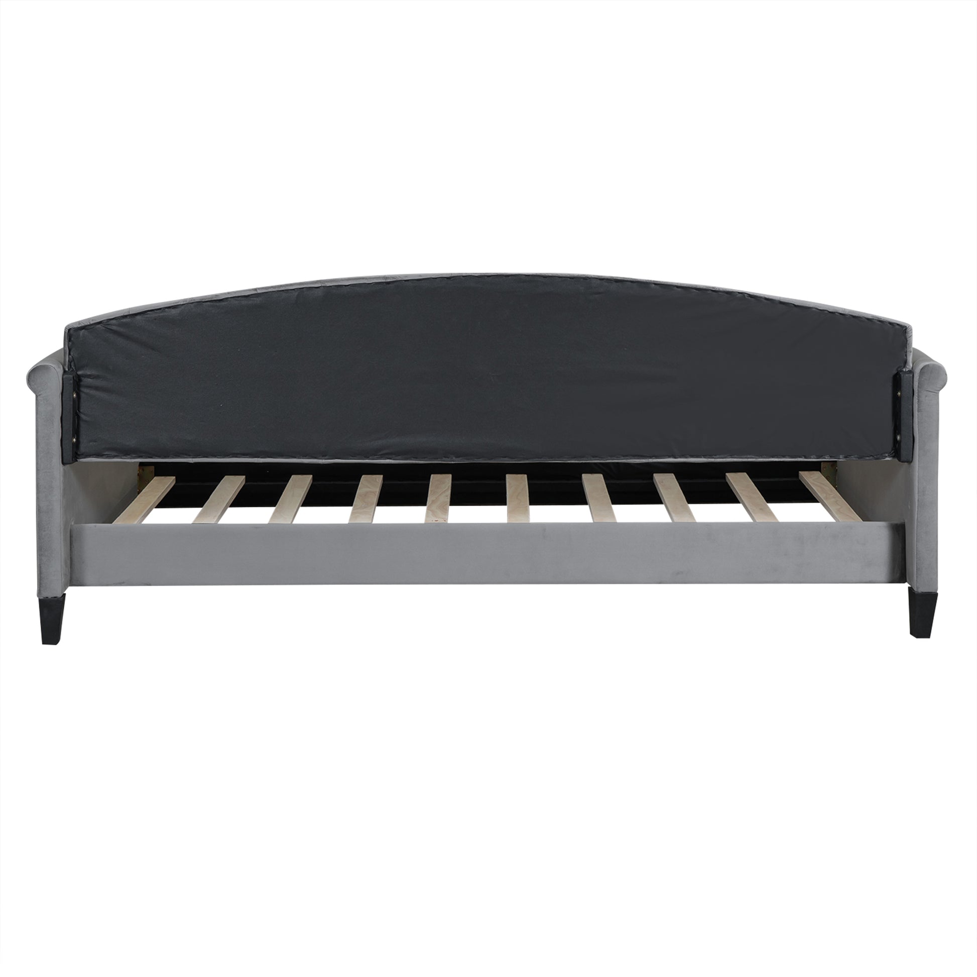 Grey velvet upholstered bed frame showing curved headboard support and wooden slats for mattress