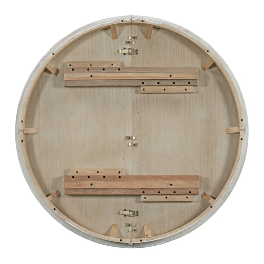 Underside of round dining table with light wood finish and metal clasps