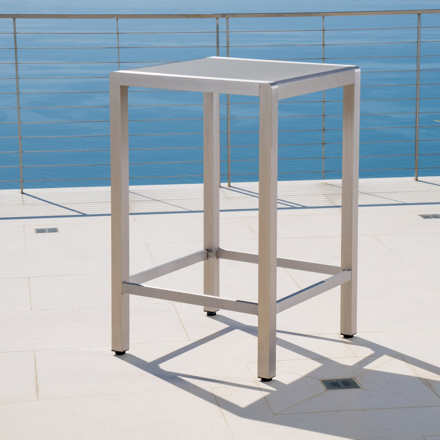 Modern silver aluminum bar stool with glass top