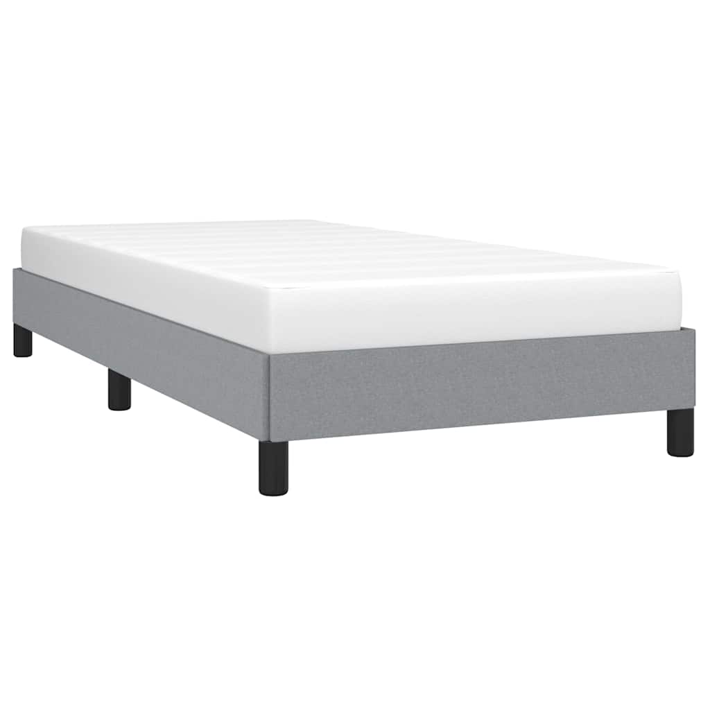 Gray upholstered twin bed frame with black legs