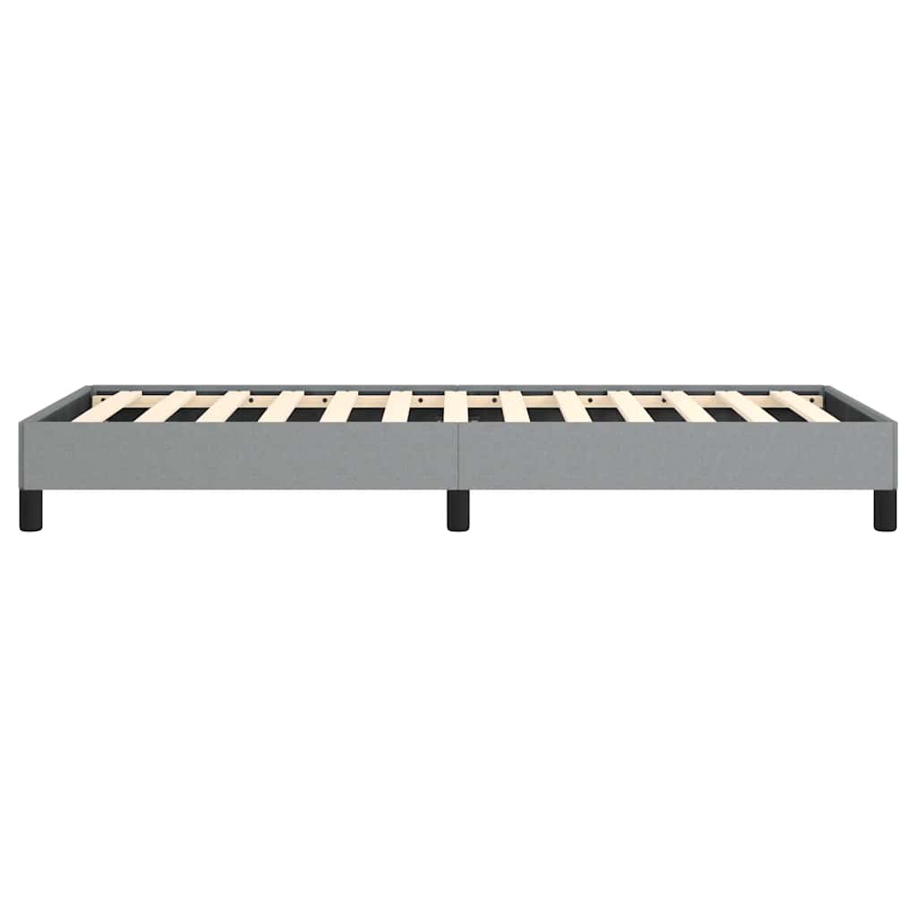 Grey upholstered platform bed frame with wooden slats